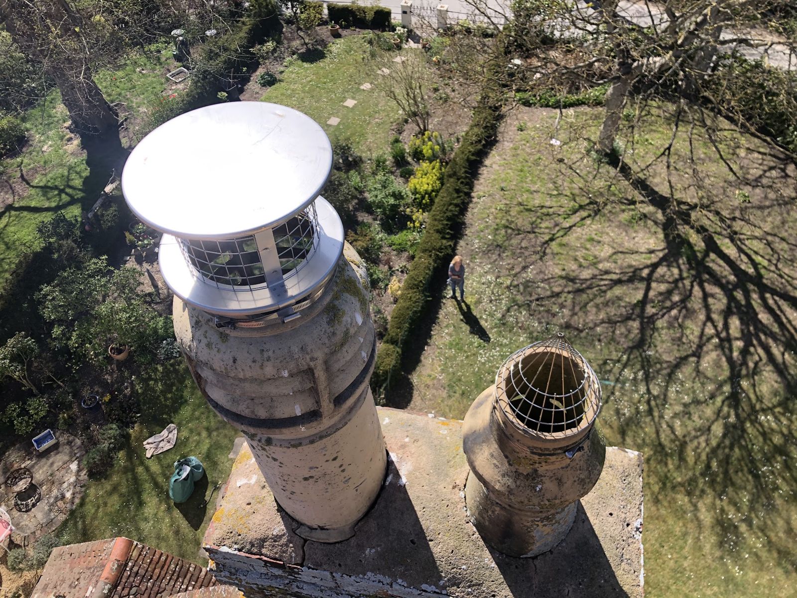 Stainless cowl on a pot, looking down onto the garden below