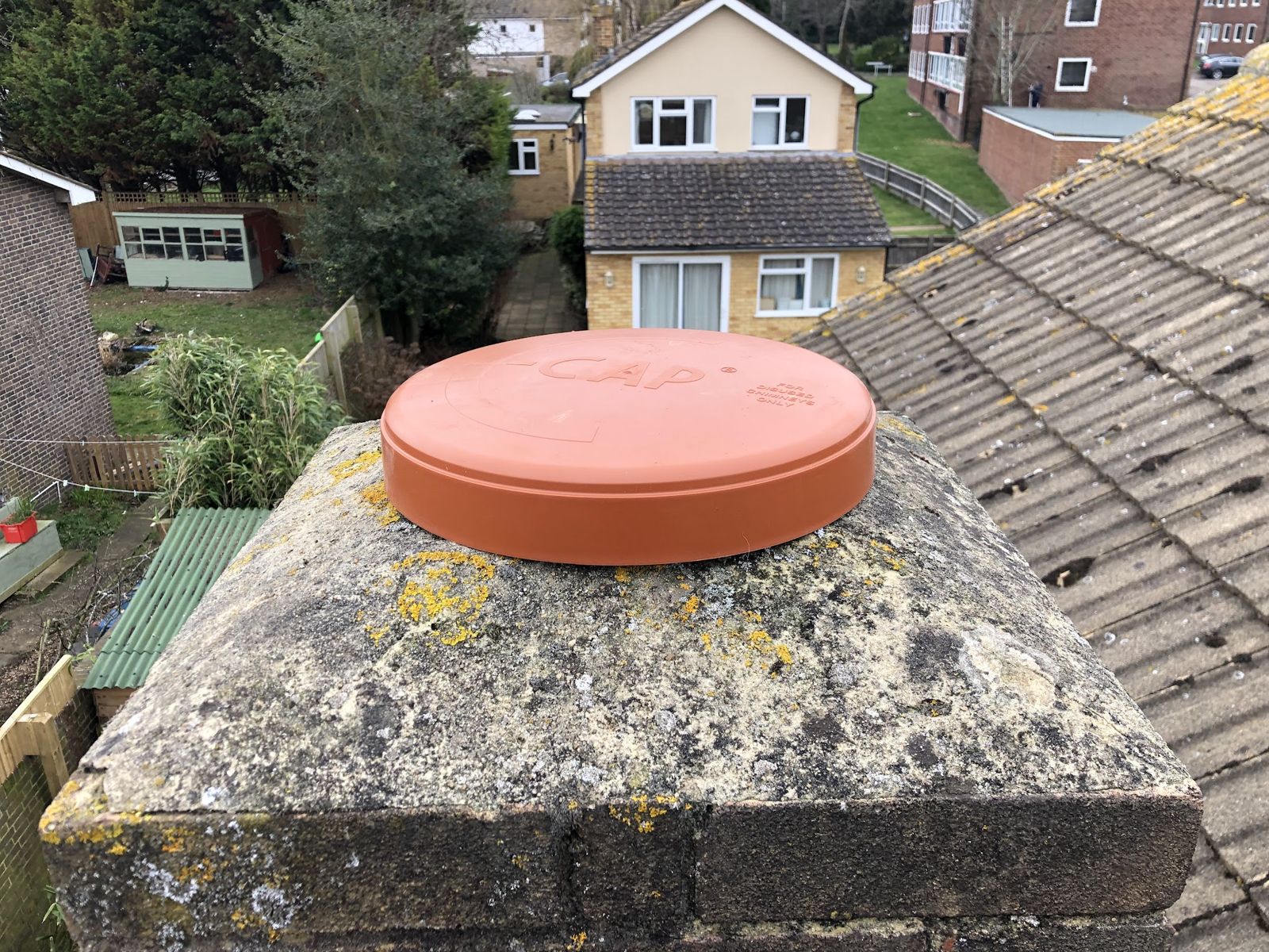 Terracotta cap sealing a chimney stack